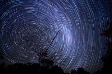 radio antenna against star trails