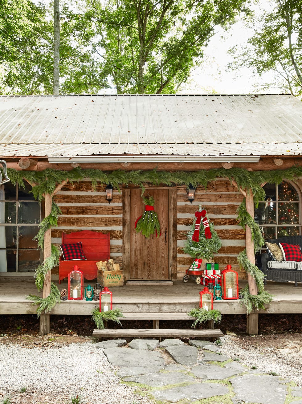 log cabin home of singer songwriter holly williams and her husband chris coleman in sparta, tennessee porch