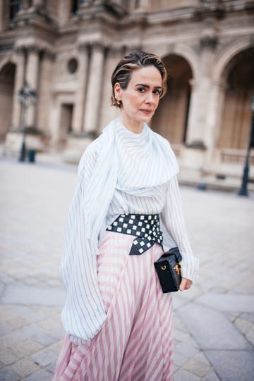 sarah paulson wearing a dress walking in paris