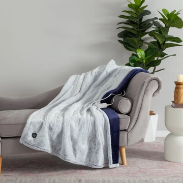 cozy throw blanket draped over a sofa