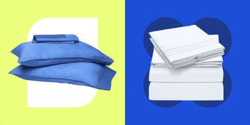 set of blue pillows and stacked white bed sheets