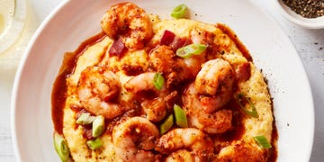 shrimp and grits in a bowl with greens onion