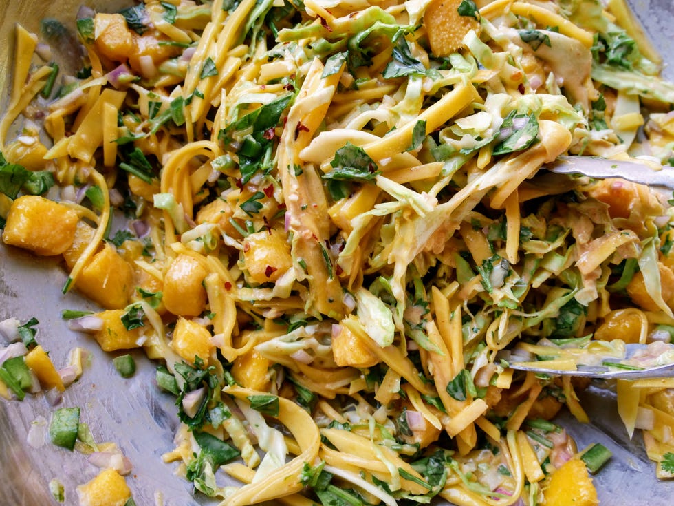 spicy mango slaw with cabbage, mint, cilantro, shallots