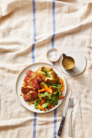 steak au poivre with a side salad and baked potato