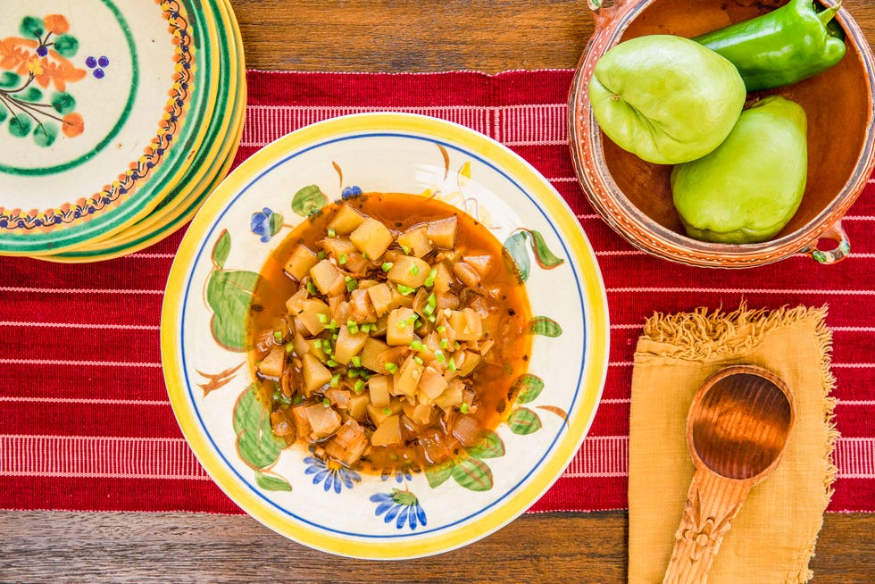 cubed sautéed chayote in a skillet