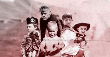 group of children posing in historical outfits