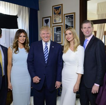 donald trump jr, melania trump, donald trump, ivanka trump, eric trump, and tiffany trump stand inside a room and smile for a photo