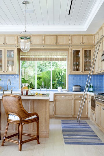 beachy light wood kitchen with blue tile backsplash