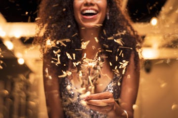 woman holding fire sparkler