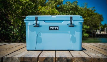 blue yeti tundra cooler on dock by lake