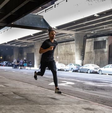 young afroamerican man getting fit in los angeles downtown city streets