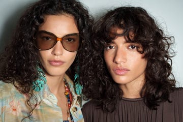 two girls with curly hair