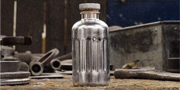 Bottle, Drinkware, Glass bottle, Glass, Grey, Transparent material, Still life photography, Mesh, Cylinder, Silver, 