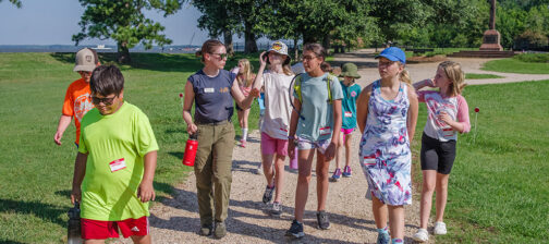 Staff Archaeologist Natalie Reid leads a tour of Jamestown on the first day of Kids Camp.