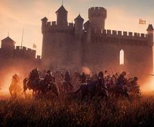 A medieval castle under attack by knights on horseback