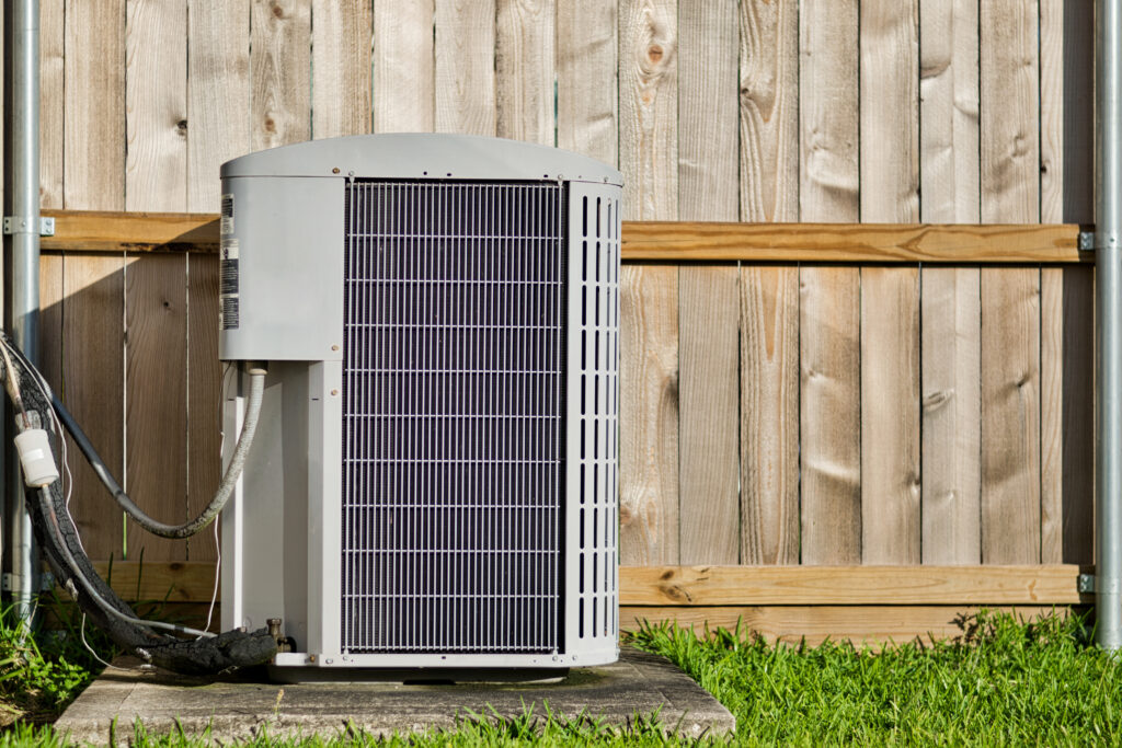 Central air conditioning unit in a residential backyard for AC Repair