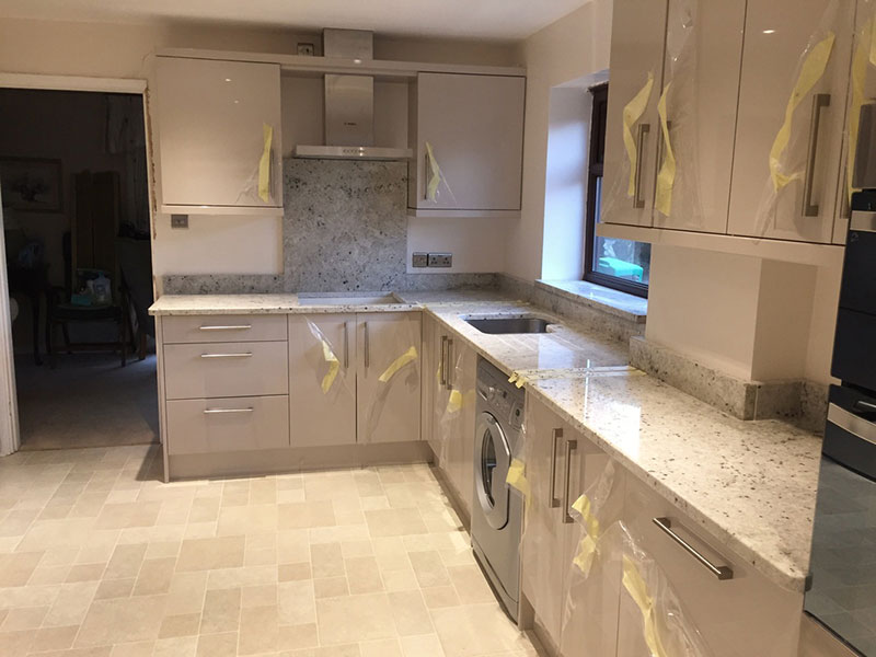 Modern kitchen with colonial white granite countertops