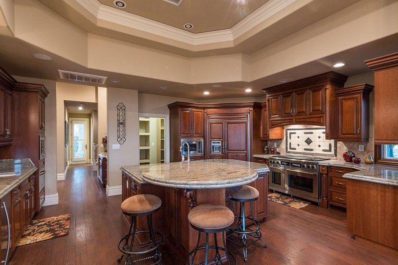 Oak kitchen cabinets with colonial white granite