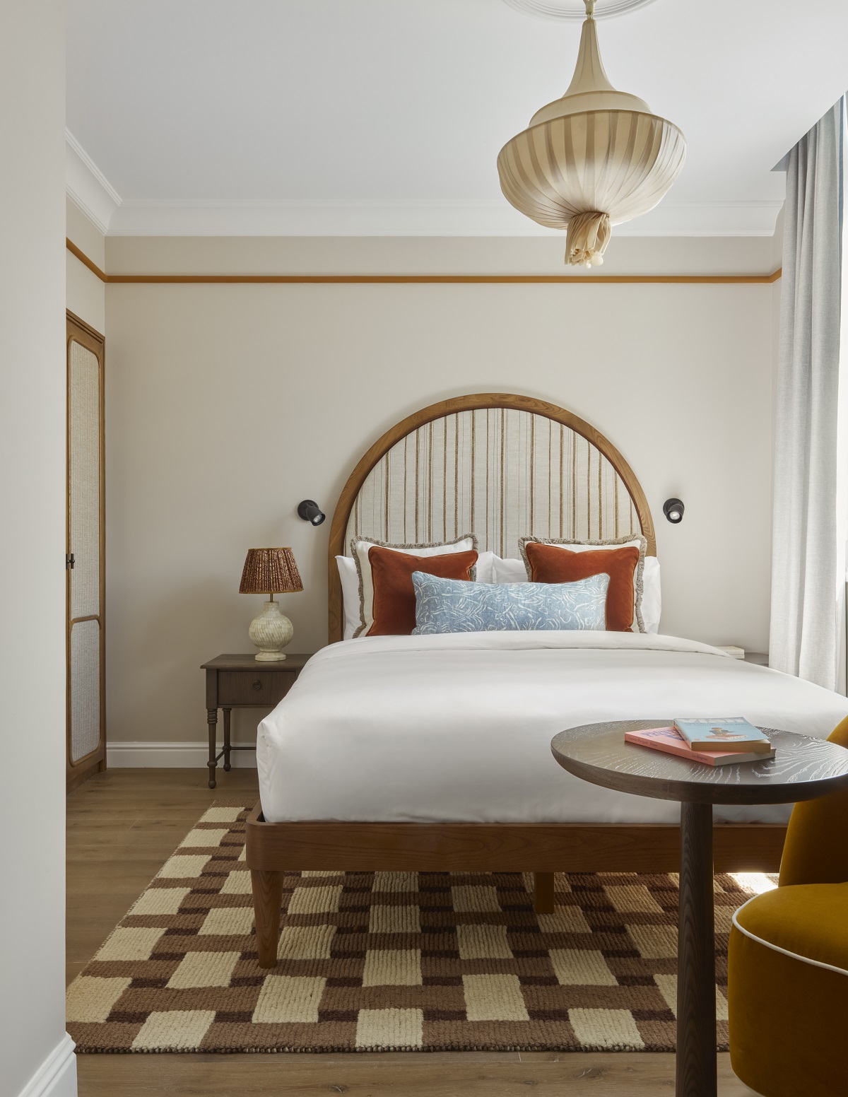 checked carpet and autumnal colours in a guestroom at Le Grand Hôtel Cayré