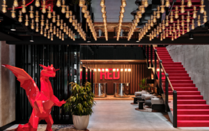 feature lighting on ceiling and red dragon at entrance to Radisson Red Krakow