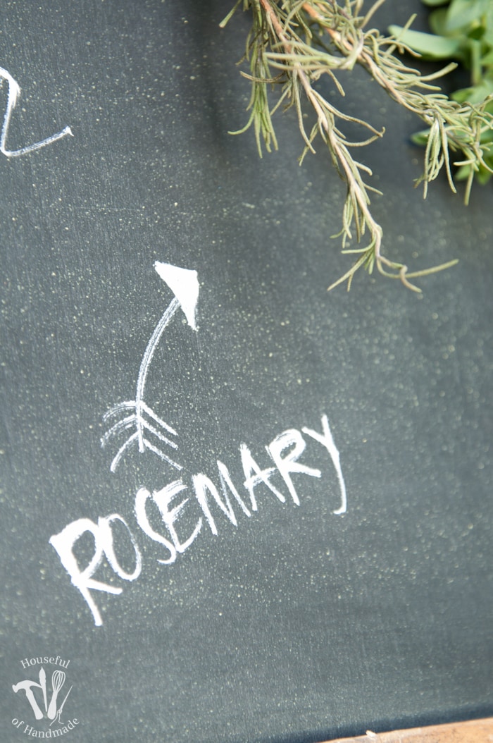 Make drying your herbs a part of your decor with this DIY rustic chalkboard herb drying rack. It's made from an old pallet and makes preserving herbs beautiful. | Housefulofhandmade.com