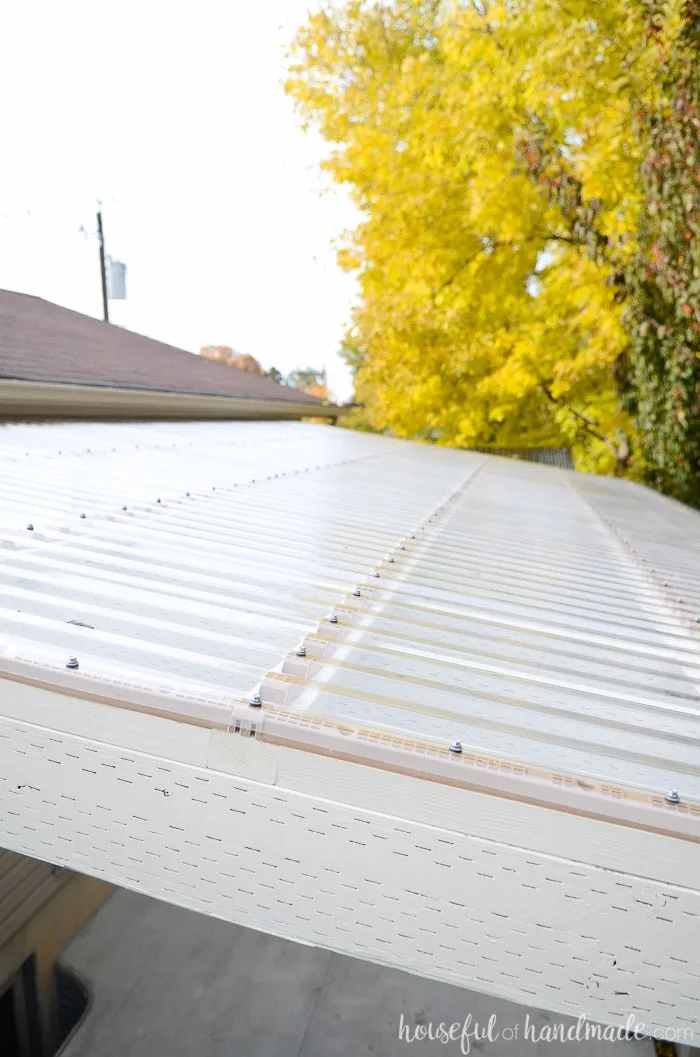 Create a beautiful covered patio. See how we transformed our unused side yard into a beautiful space with a clear pergola roof. Housefulofhandmade.com