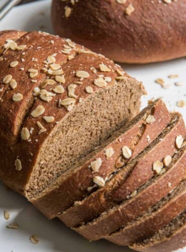 sliced brown molasses bread with oats on top