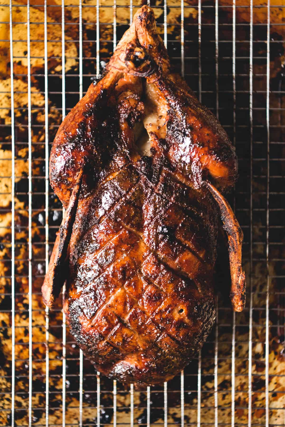 An image of a honey roast duck recipe after being pulled out of the oven.