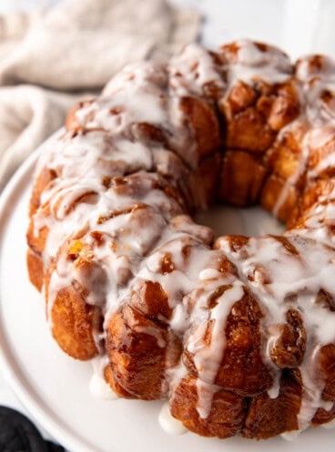 An image of homemade monkey bread on a white plate.