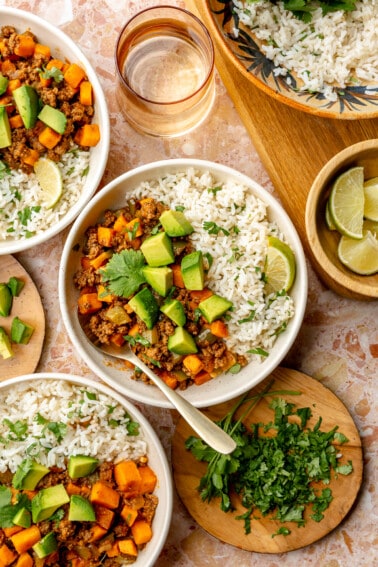 Ground beef and sweet potato served over rice and topped with avocado.