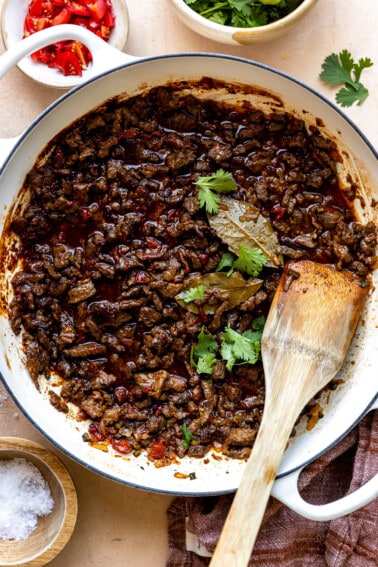 White braising skillet filled with carne picada,