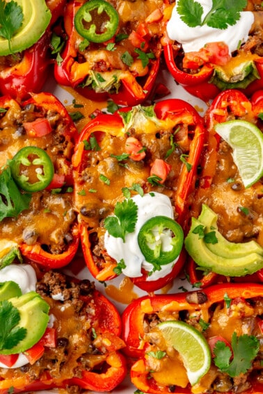 Taco stuffed bell peppers topped with sour cream.