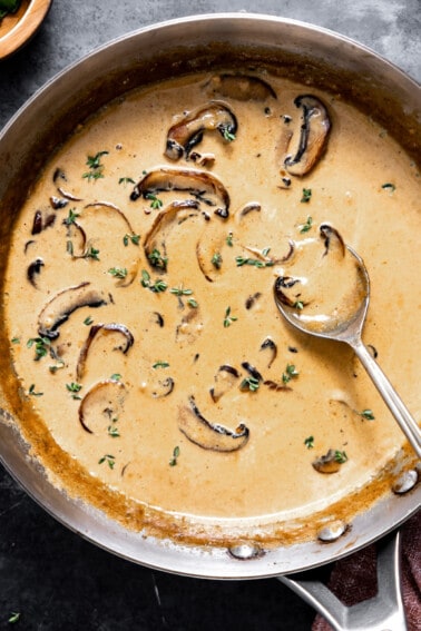 Skillet with creamy mushroom sauce for steak.