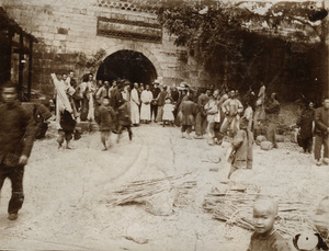 Chinese and Europeans beside a city gate