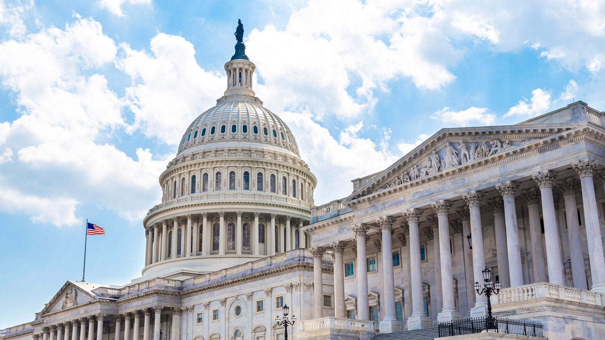 U.S. Capitol building exterior on a sunny day.