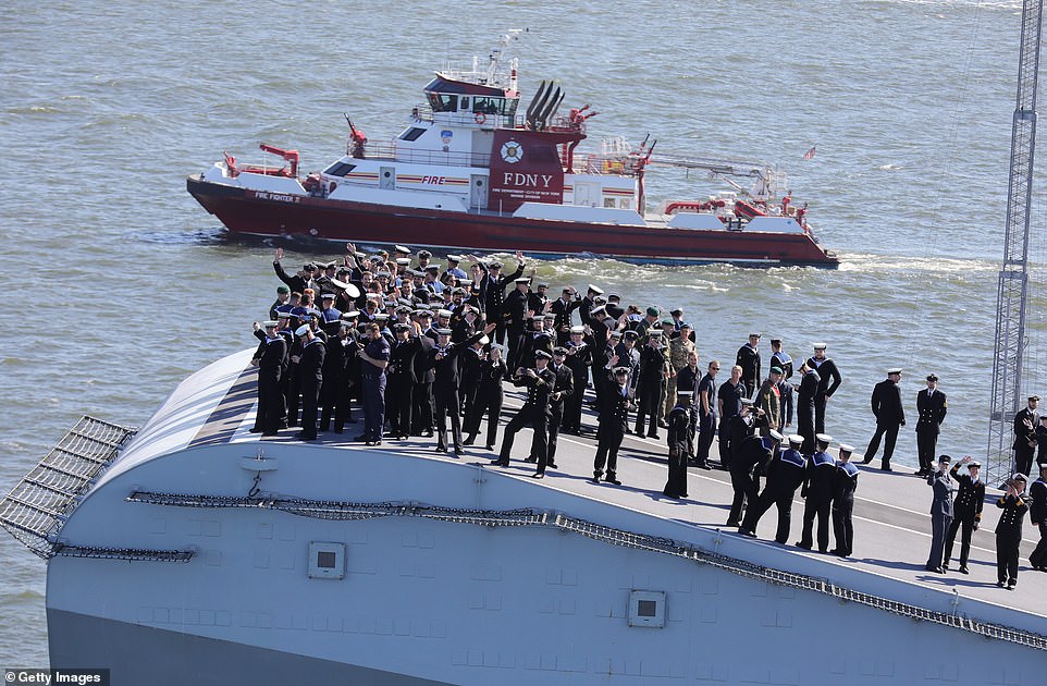 Personnel on board 'Big Lizzie' waved and took pictures of Manhattan upon their arrival in the Big Apple 