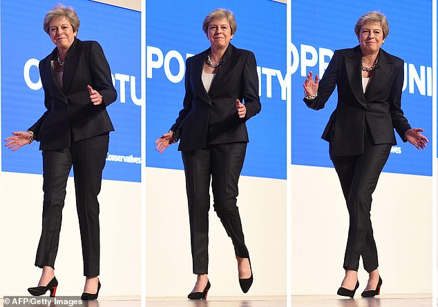 Awkward: The Prime Minister broke into dance when she arrived on stage at a Tory Party conference on October 3, ahead of her conference speech 