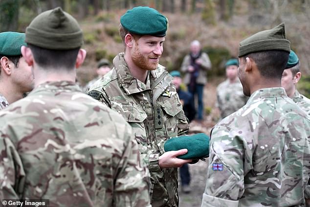 A marine beamed as Harry carried out the Green Beret presentation on Wednesday 