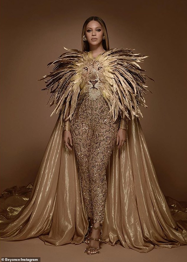 Mane attraction: The 23-time Grammy winner was wearing a gold-feathered custom Georges Hobeika catsuit and cape fittingly featuring the face of a male lion