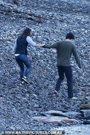 What a catch! Proving himself to be the perfect gentleman, Emma's date carried her on his back as they crossed a flowing stream of water