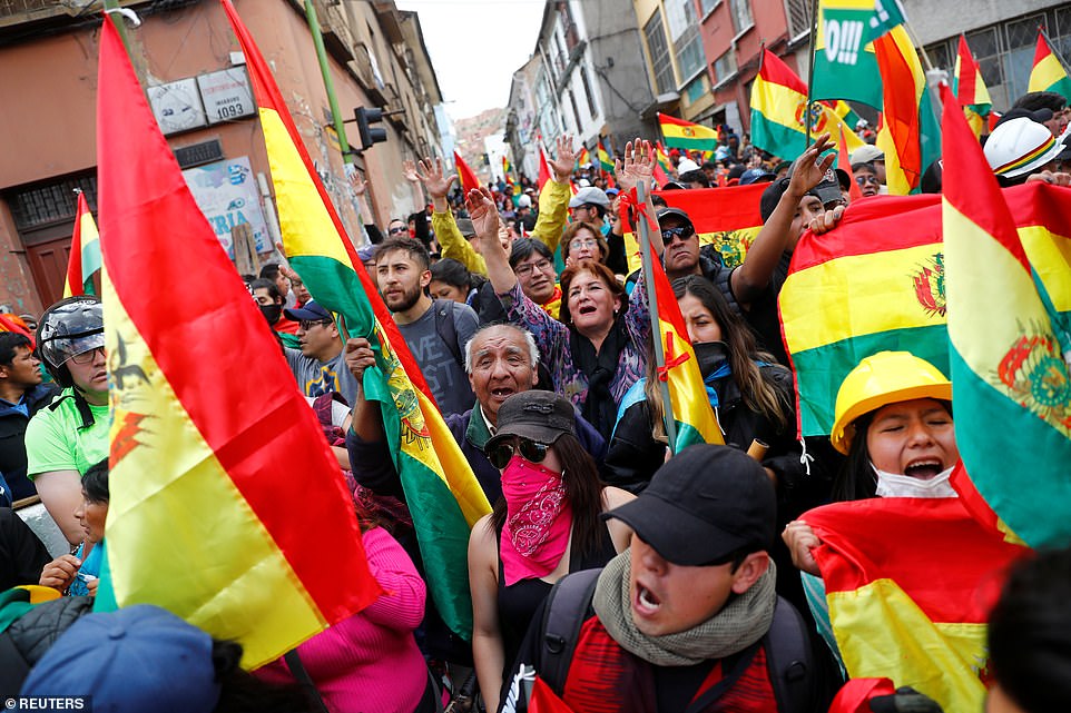 People take part in a protest against Bolivia's President Evo Morales in La Paz, Bolivia after election controversy sweeps the country