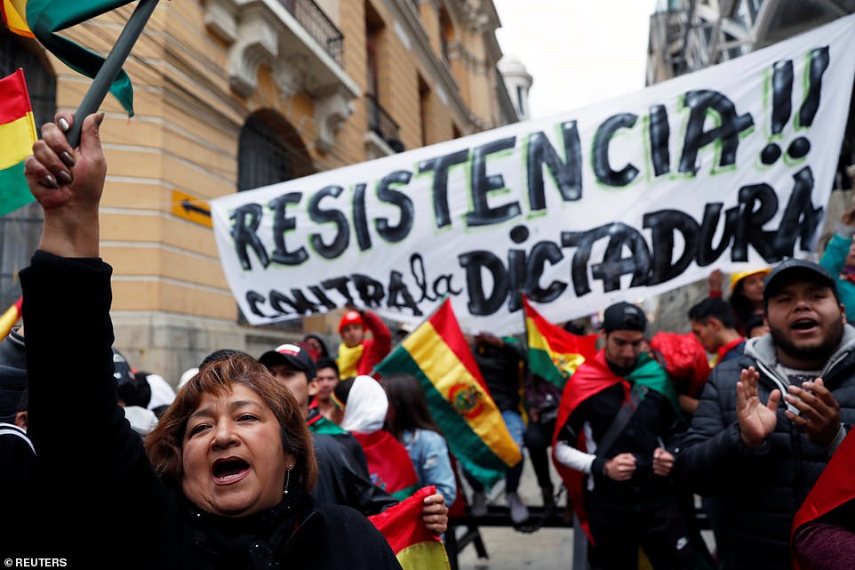 People shout slogans during a protest against Bolivia's President Evo Morales in La Paz on Saturday