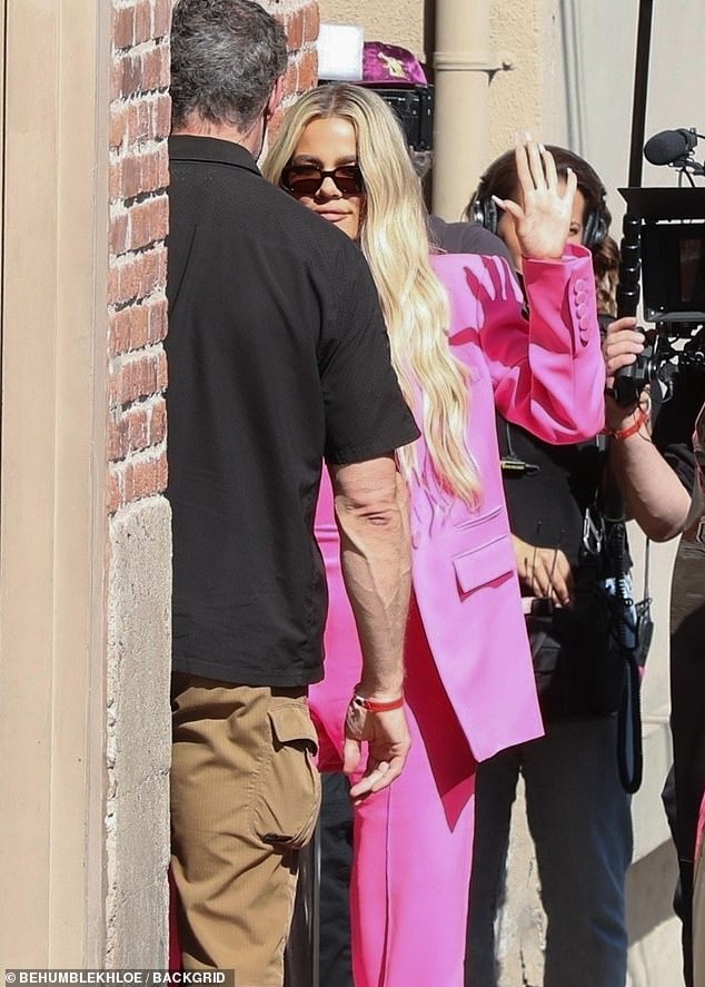 Blond beauty: The star was pictured arriving at the Hollywood studios for the late night show in a hot pink suit