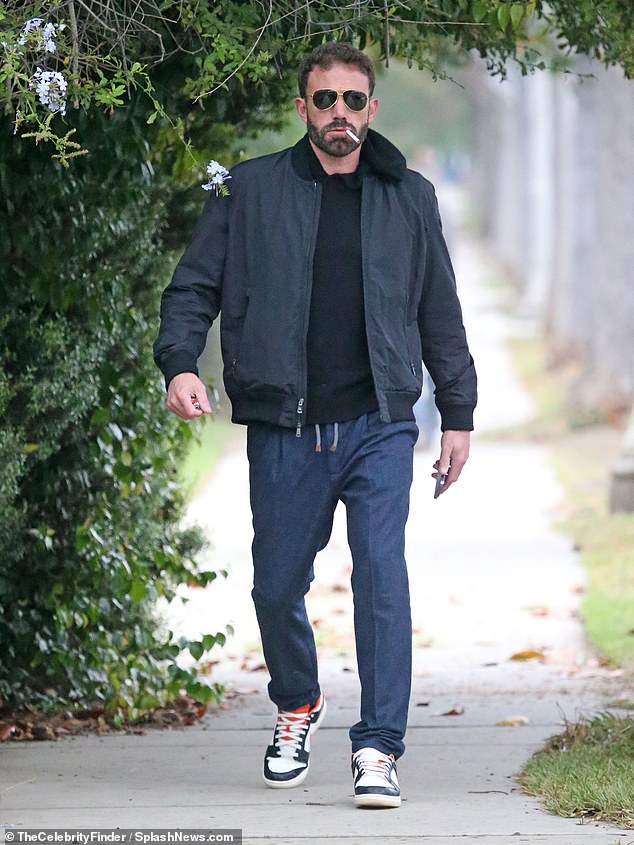 Solo smoke break: Ben Affleck was enjoying a smoke break when out early in the morning on Friday in the Brentwood neighborhood of Los Angeles