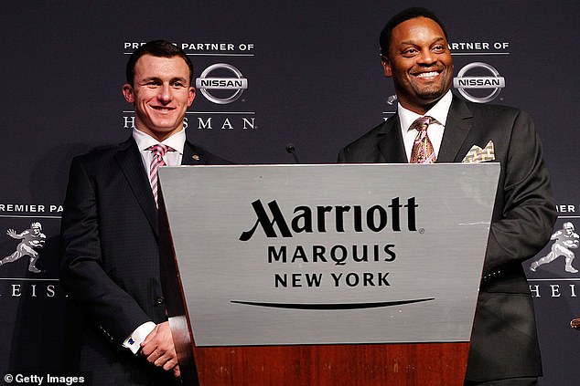 Johnny Manziel and his Texas A&M coach Kevin Sumlin pose at the 2012 Heisman ceremony