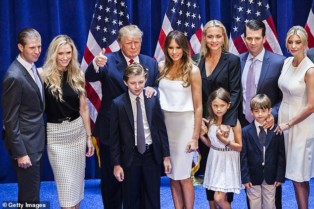 Eric Trump, Lara Yunaska Trump, Donald Trump, Barron Trump, Melania Trump, Vanessa Haydon Trump, Kai Madison Trump, Donald Trump Jr., Donald John Trump III, and Ivanka Trump pose for photos on stage after Donald Trump announced his candidacy for the US presidency at Trump Tower on June 16, 2015 in New York City