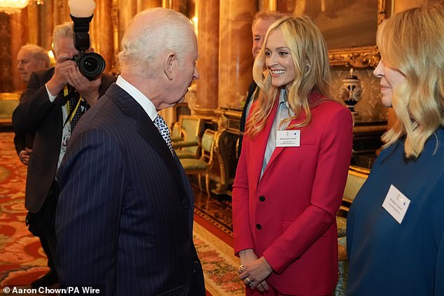 Fearne Cotton made a colourful appearance in a hot-pink blazer as she grinned while meeting the King