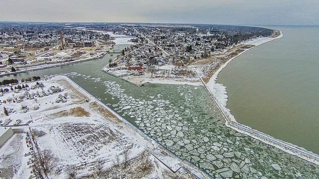 The search of the waterway, meanwhile, comes on the cusp of the town's cold season, set to start Monday. Around this time, parts of the river are known to ice over, with some ice already seen when the boy went missing. Pictured, the section of the river being searched  during winter