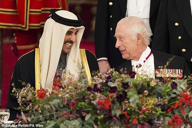 The King captured in conversation with his Qatari counterpart