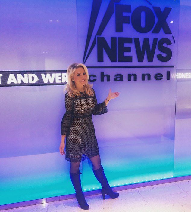 Powers poses in the Fox News offices